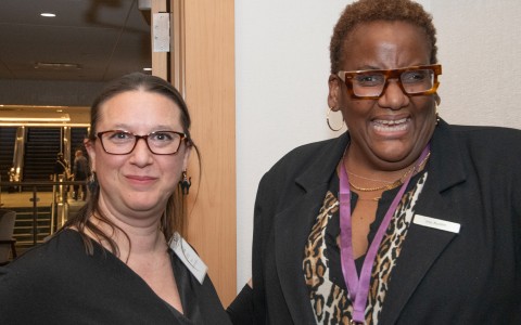 a group of women smiling at camera
