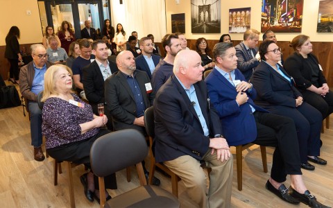 a group of people sitting in chairs