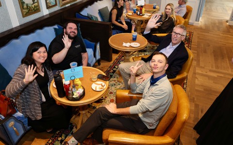 a group of people sitting at tables