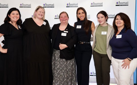 a group of women posing for a photo