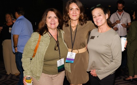 a group of women posing for a photo