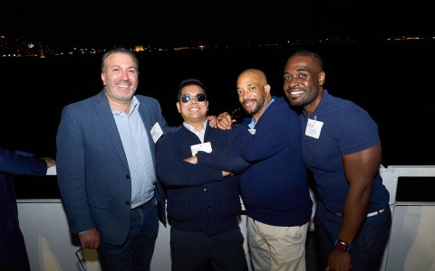 a group of men posing for a photo