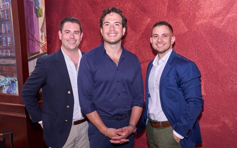 a group of men posing for a picture