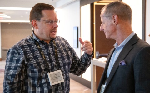 a man talking to another man