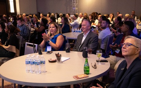 a group of people sitting at tables
