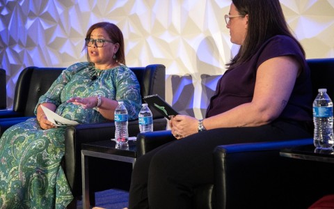 two women sitting in chairs