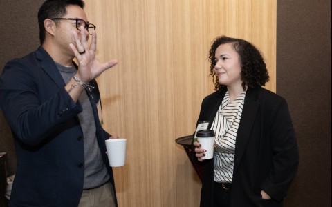 a man and woman talking to each other