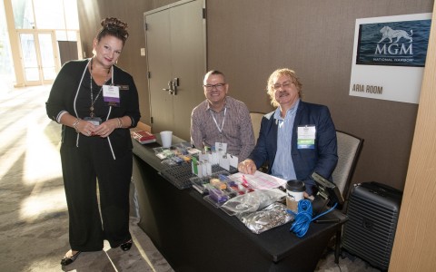 a group of people standing at a desk