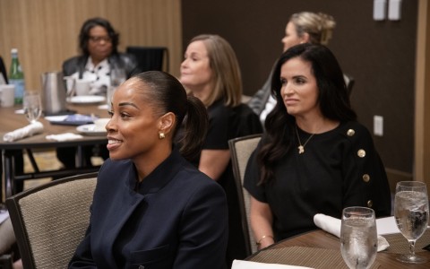a group of women sitting at a table