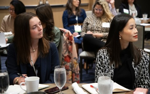 a group of women sitting at a table