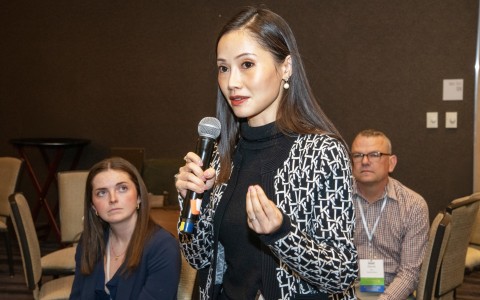 a woman holding a microphone