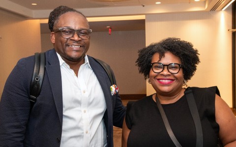 a man and woman smiling at camera
