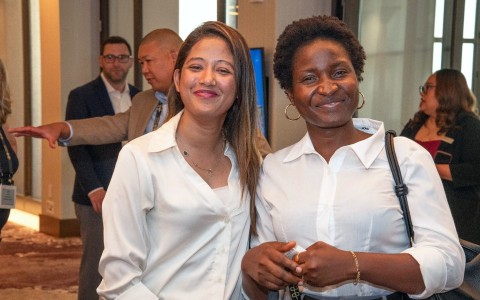 two women smiling at the camera
