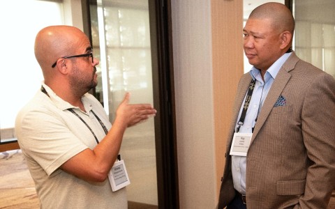 a group of men talking to each other