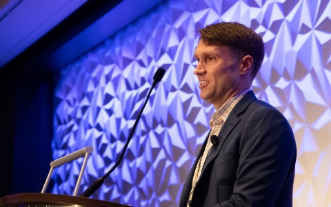 a man standing at a podium