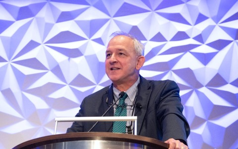 a man standing at a podium