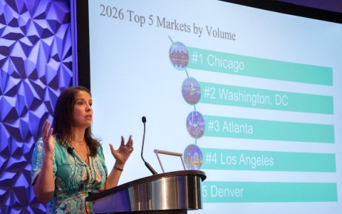 a woman standing at a podium