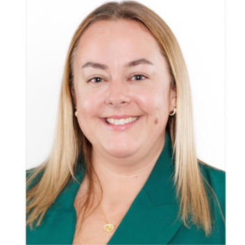 a woman wearing a green jacket