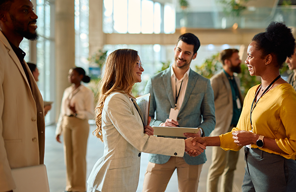 a woman shaking hands with a man
