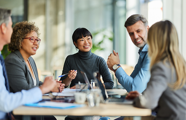 a group of people sitting around a table