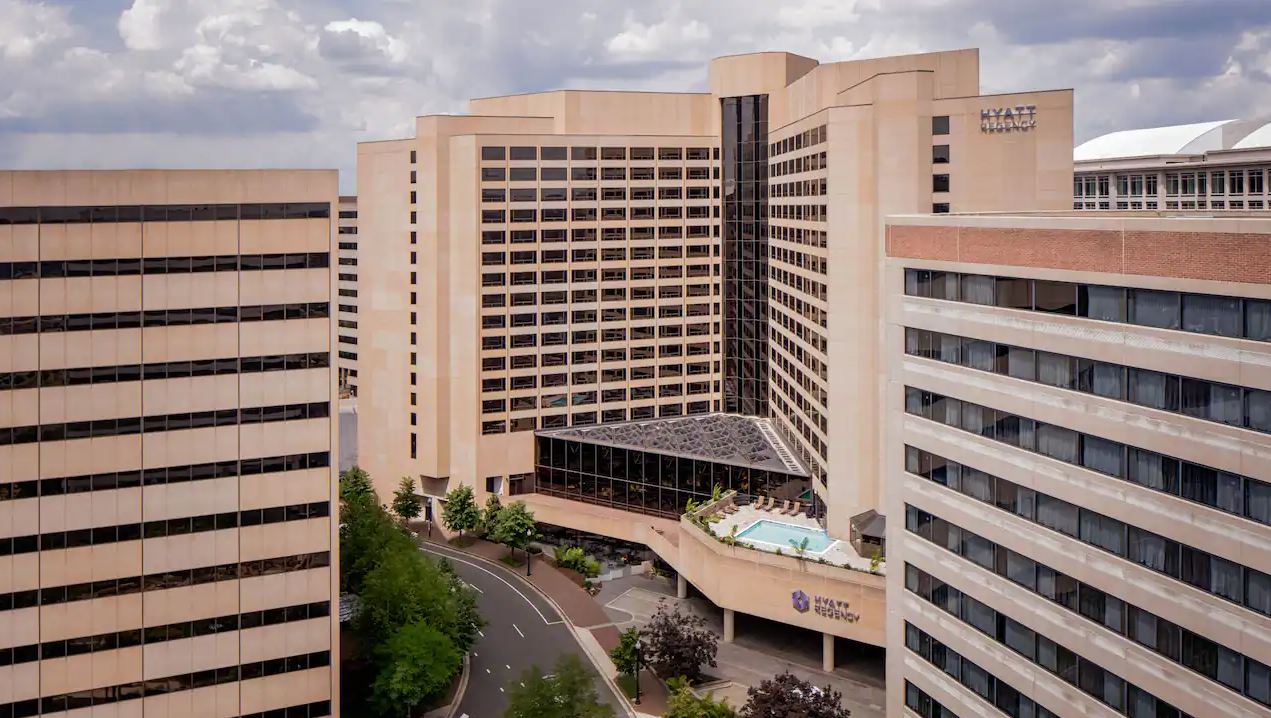 a large building with a pool in the middle of it