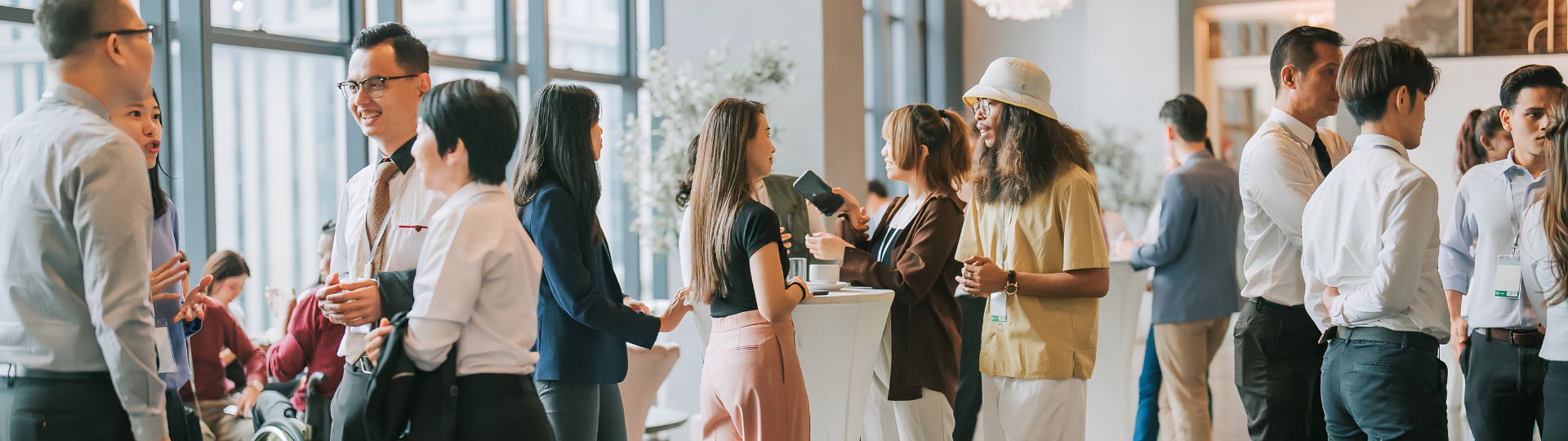 a group of people standing around a table