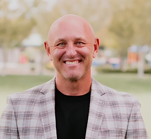 a man smiling at the camera