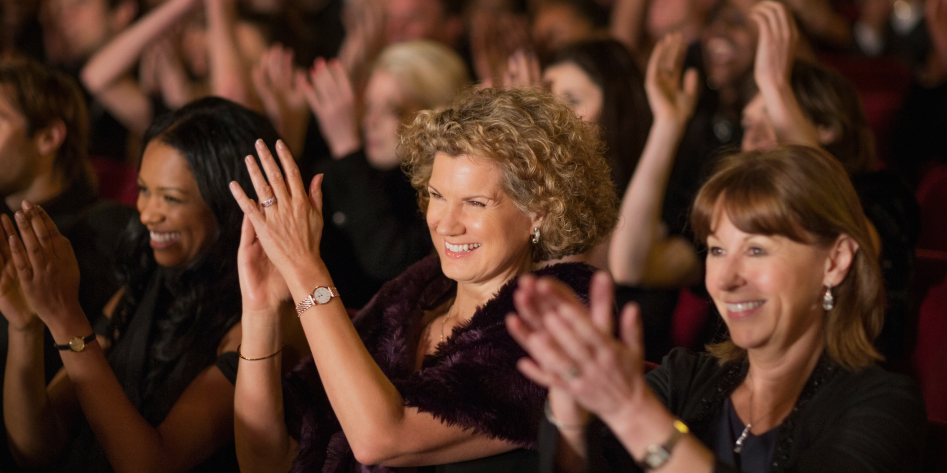 a woman clapping her hands