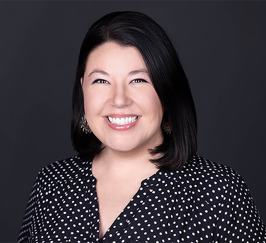 a woman smiling with black hair