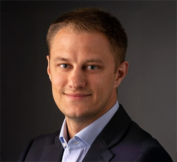 a man in a suit smiling