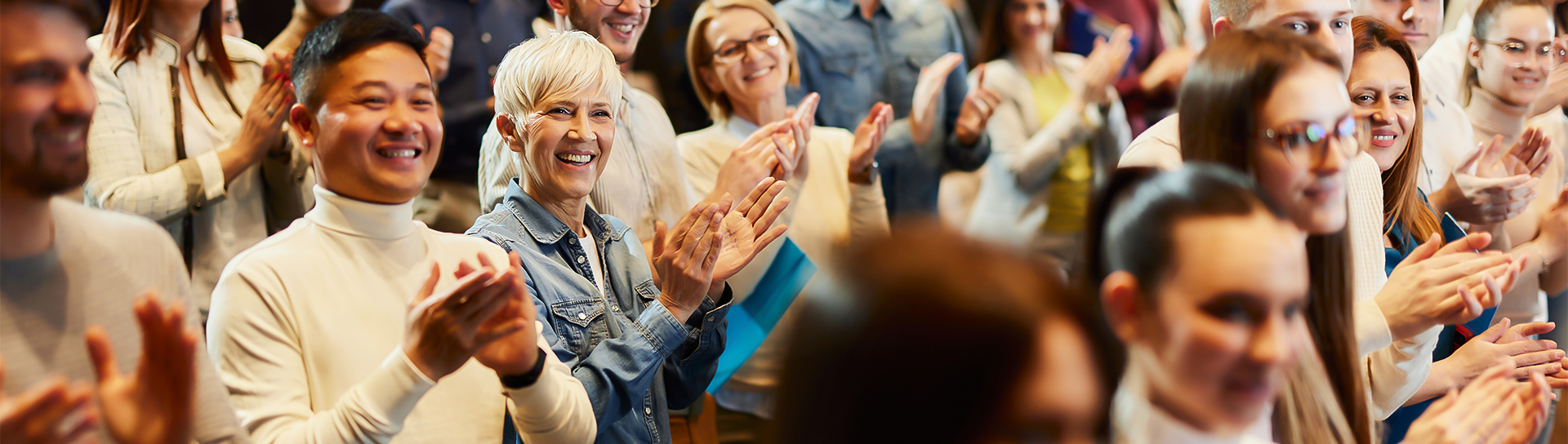 a group of people clapping hands
