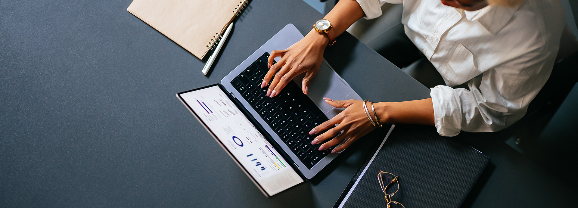 a person typing on a laptop