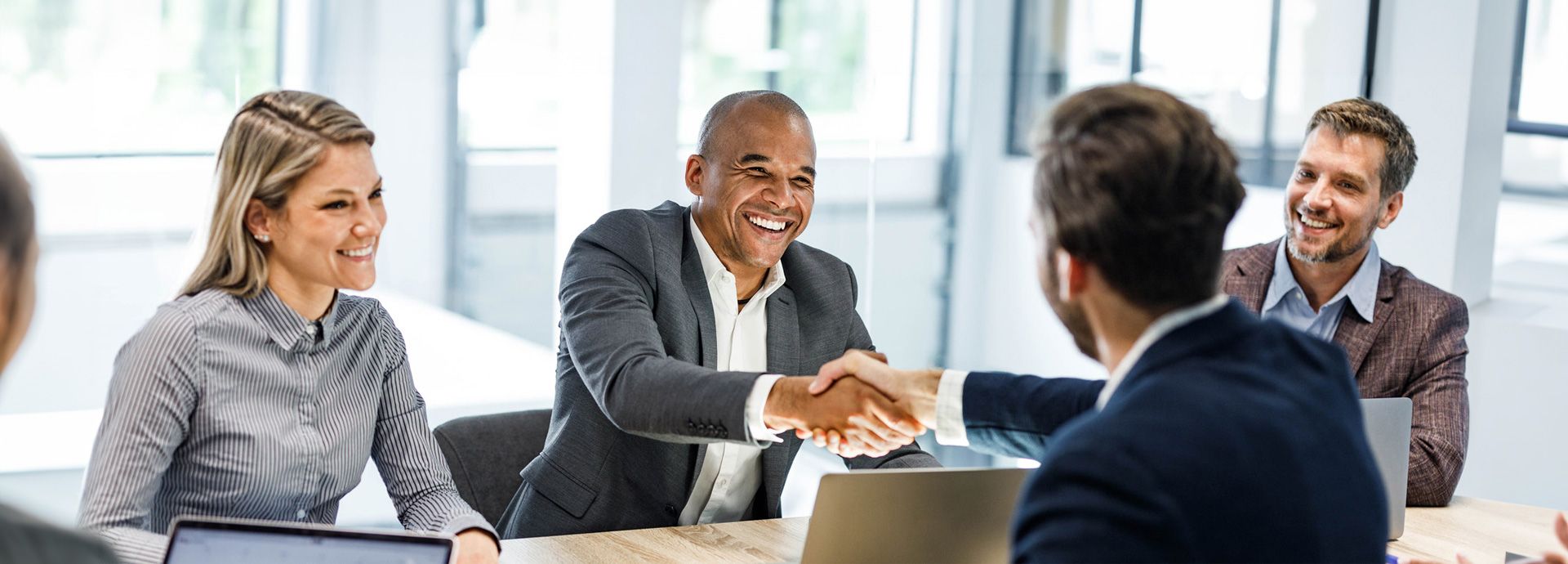 a man shaking hands with another man