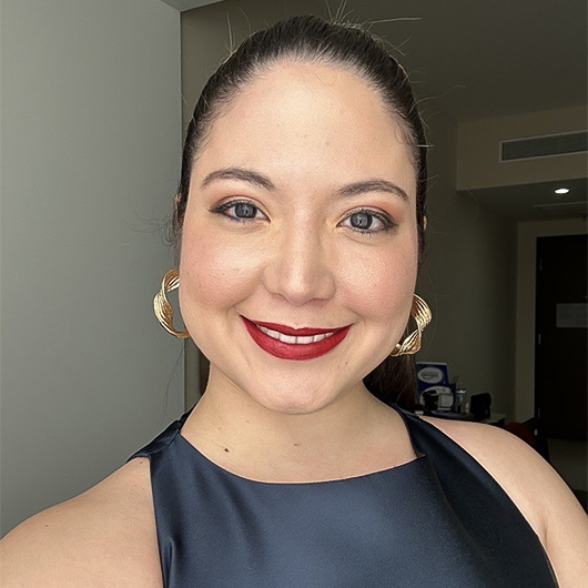 a woman smiling for a selfie