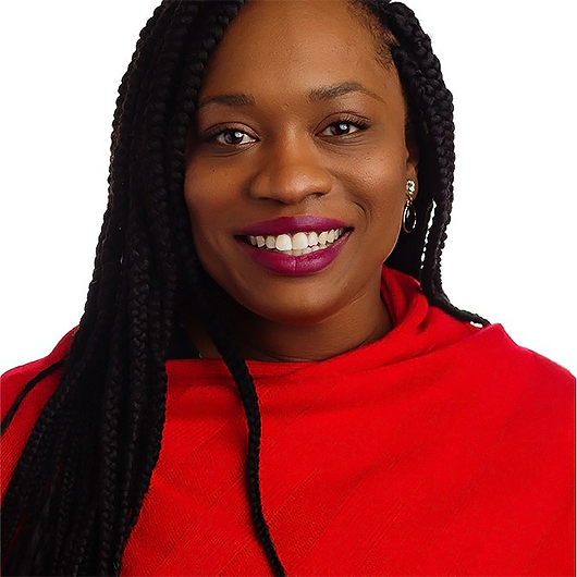 a woman with braids wearing a red shirt