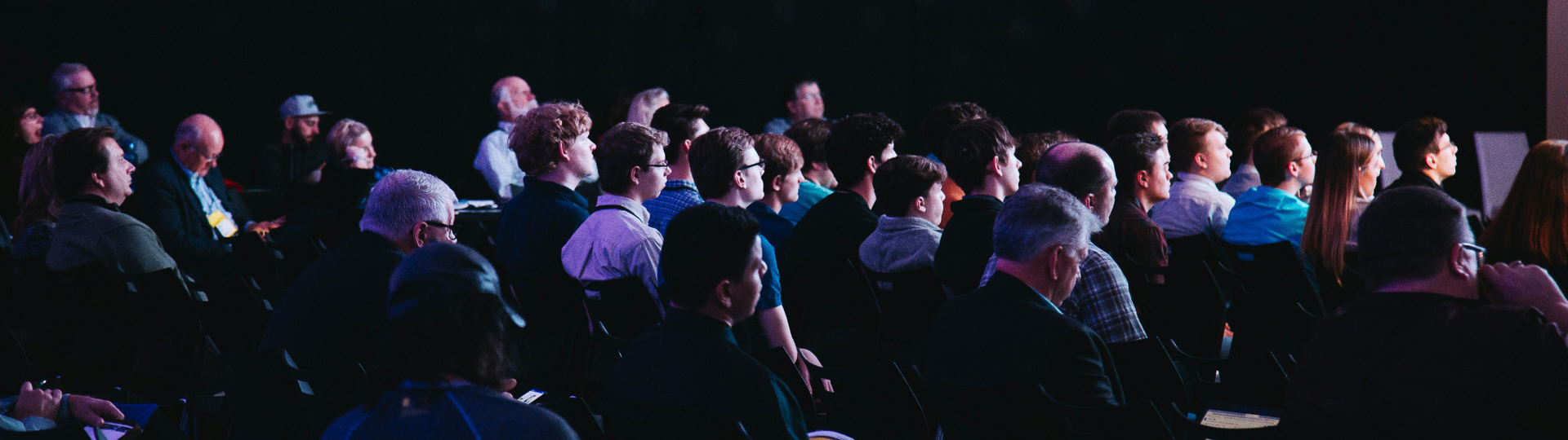 a group of people sitting in chairs