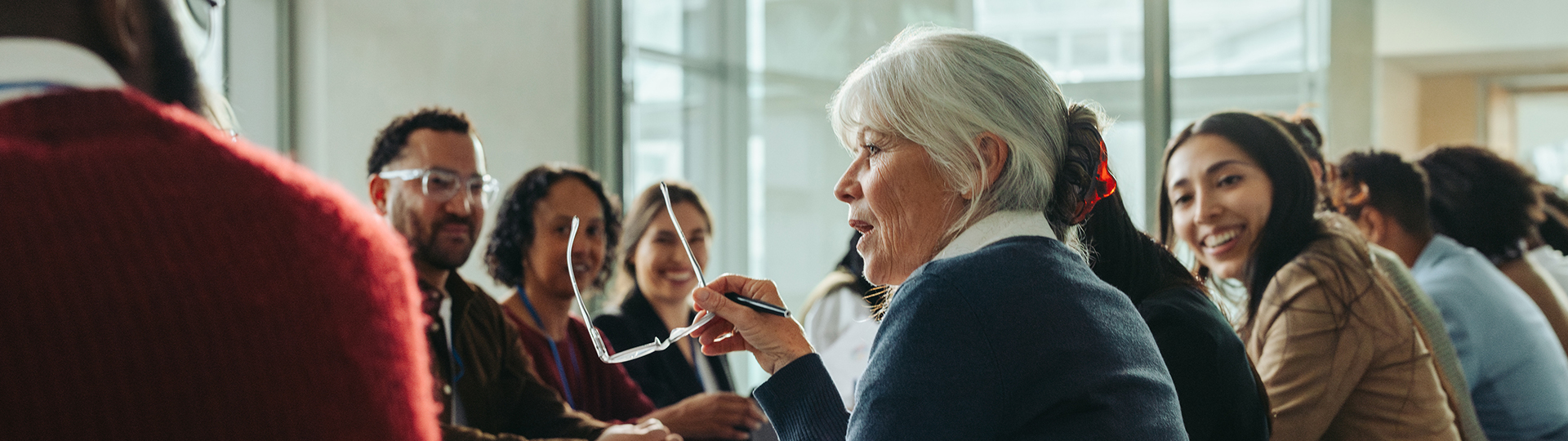 a woman holding glasses in her hand