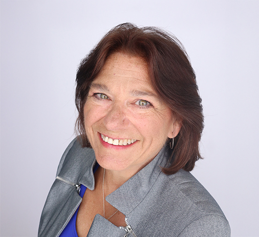 a woman smiling at the camera