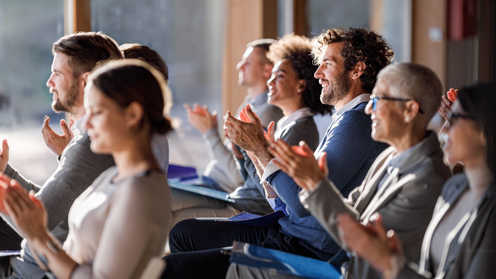 a group of people clapping