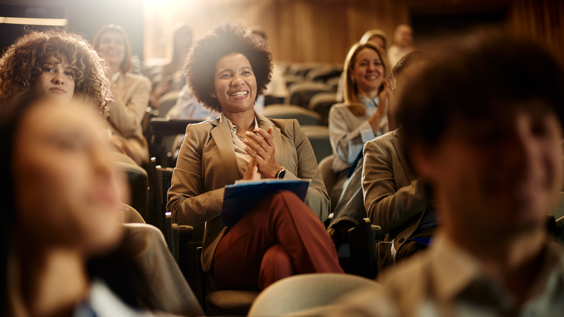 a woman sitting in a conference room