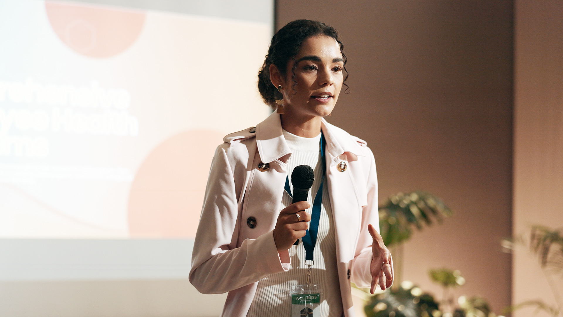 a woman speaking into a microphone
