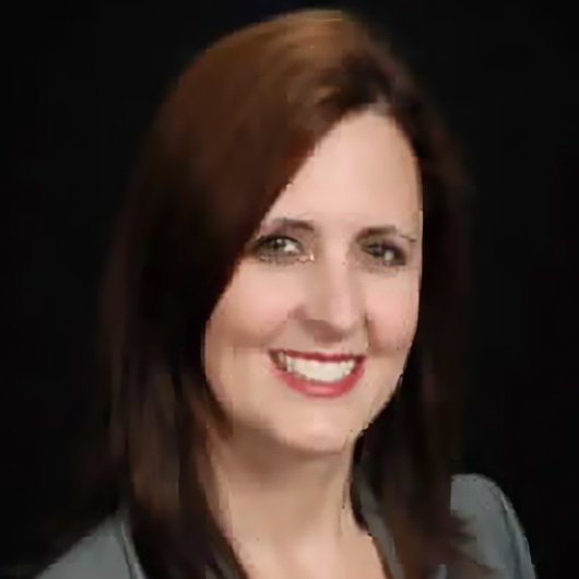 a woman with brown hair smiling