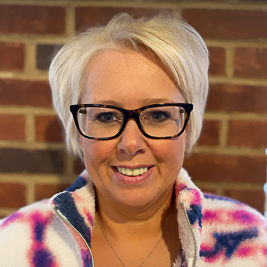 a woman smiling at camera