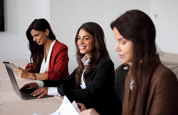 a group of women sitting at a table