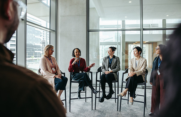 a group of women sitting in chairs