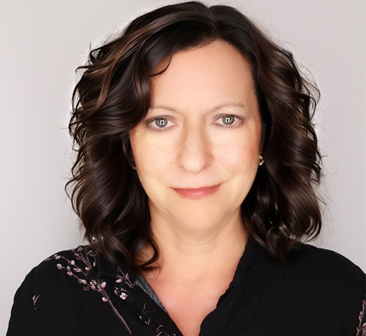 a woman with brown hair wearing a black shirt