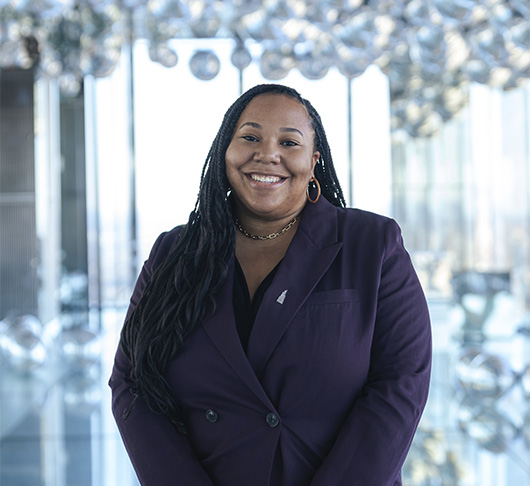 a woman in a purple suit