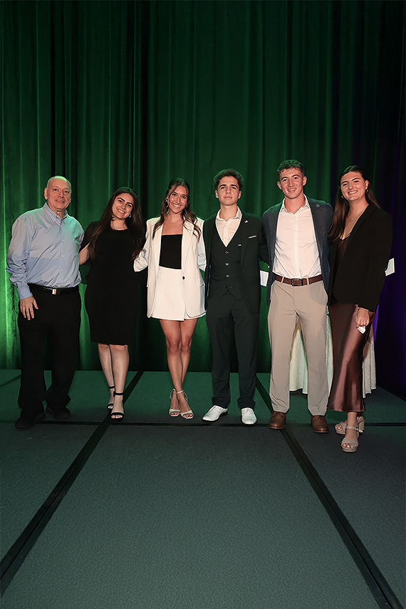 a group of people standing together on a stage