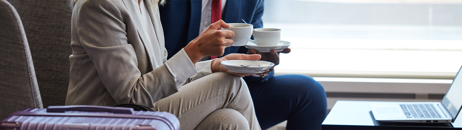 a person holding a cup of coffee
