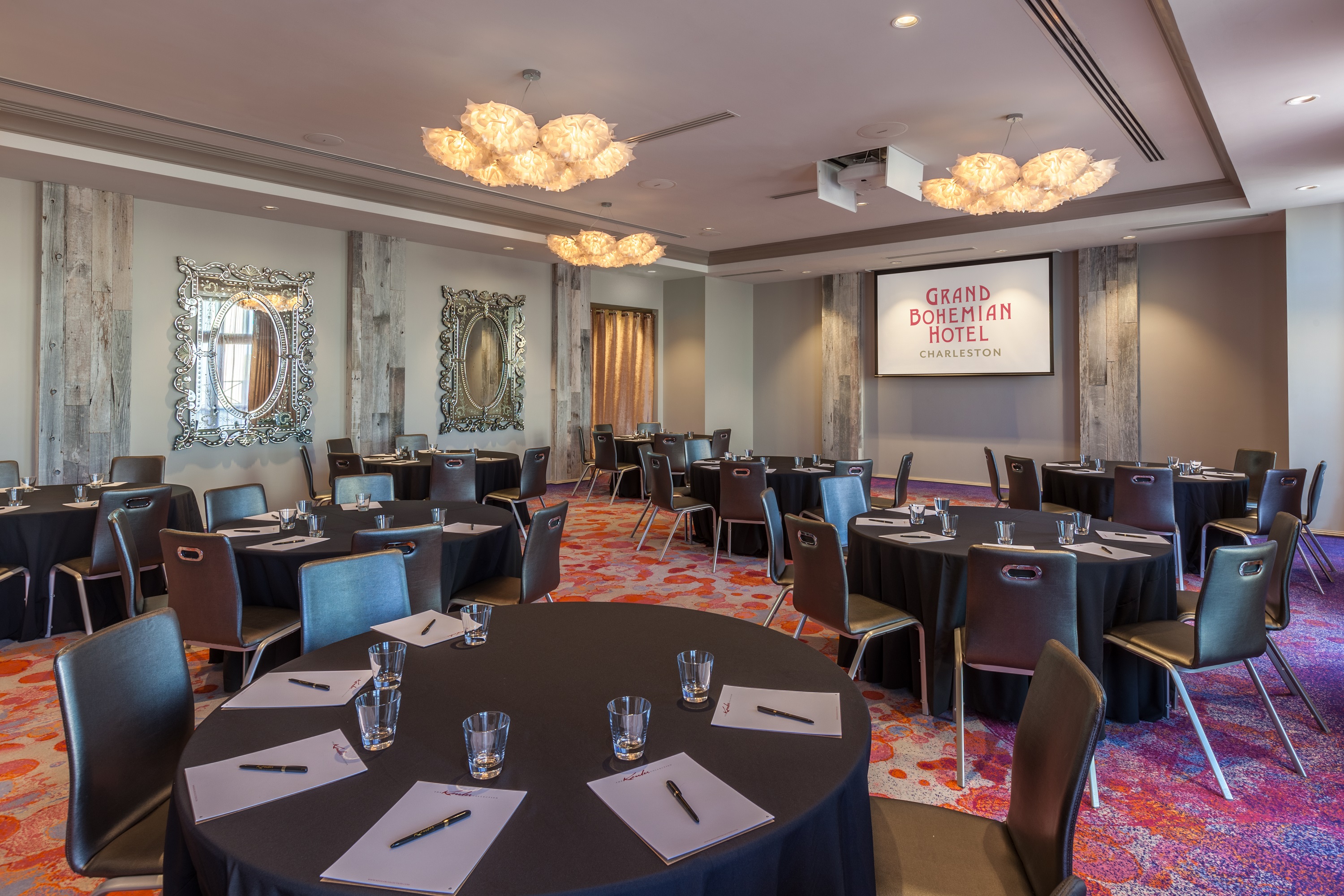 a room with round tables and chairs